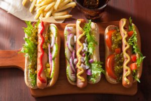 A selection of three hot dogs from Good Dog Houston, a cheap restaurant in Houston.