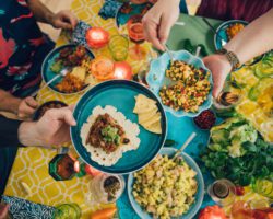 A group of friends enjoying Tex-Mex cuisine, one of the best cheap eats in Houston.