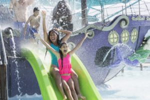 Kids playing on a splash pad at one of the biggest water parks in Florida.