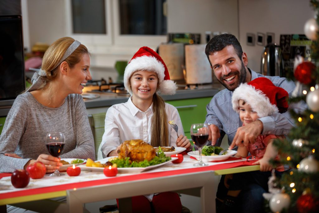 A family having a small christmas meal together. 