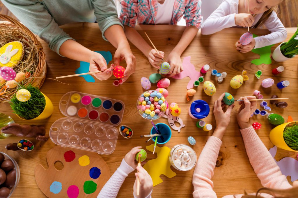 kids enjoying a fun easter craft - egg decorating