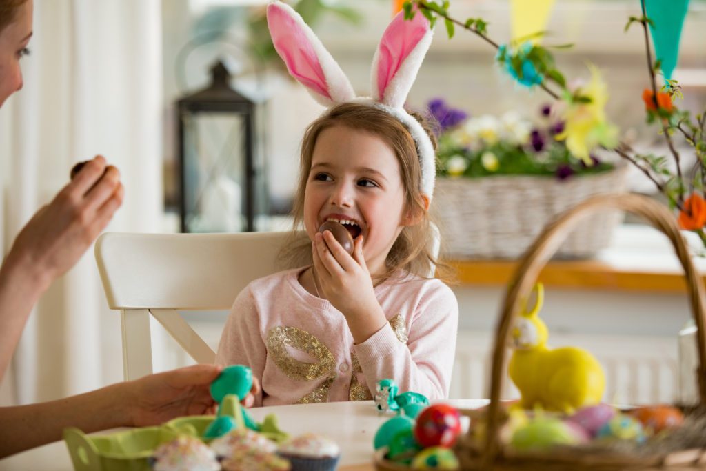 a young girl enjoying a yummy easter treat