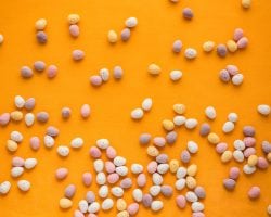 a fun easter craft background with eggg-shaped candies