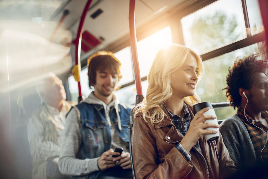 Young woman riding in a bus