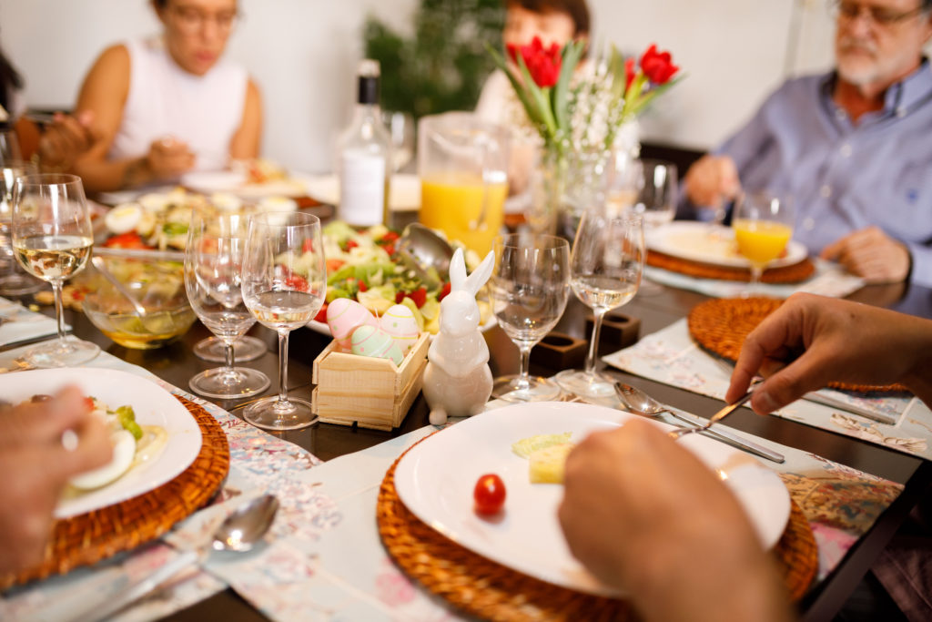 A core family having dinner at home, one way to celebrate Easter safely.