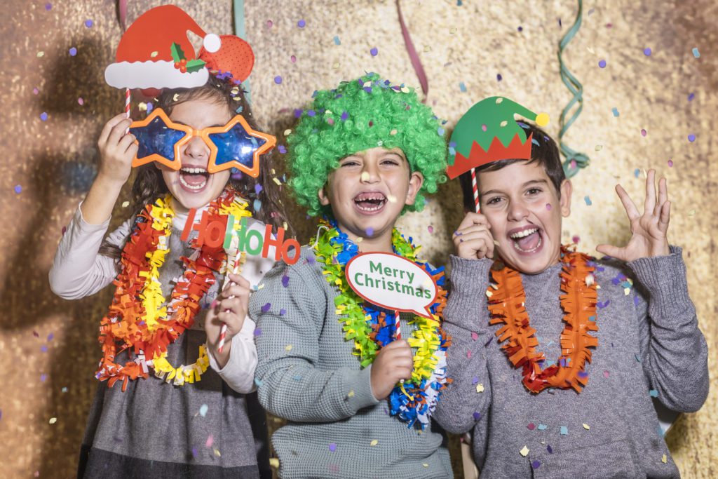 a group of kids celebrating christmas in houston