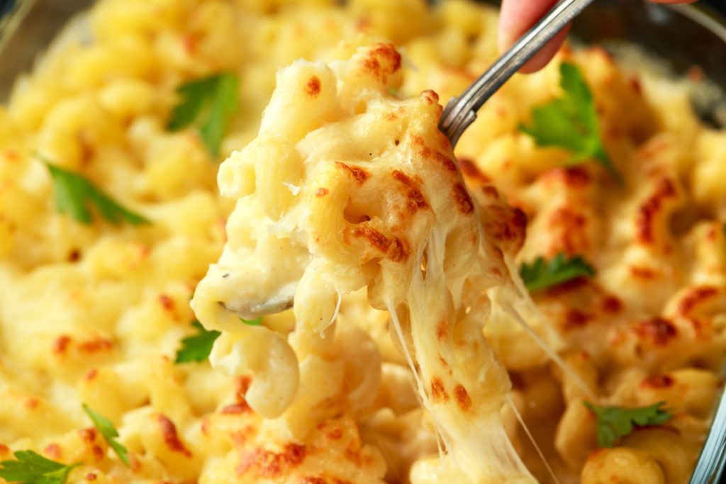 mac and cheese cooked in a slow cooker is a great alternative to traditional baked mac and cheese