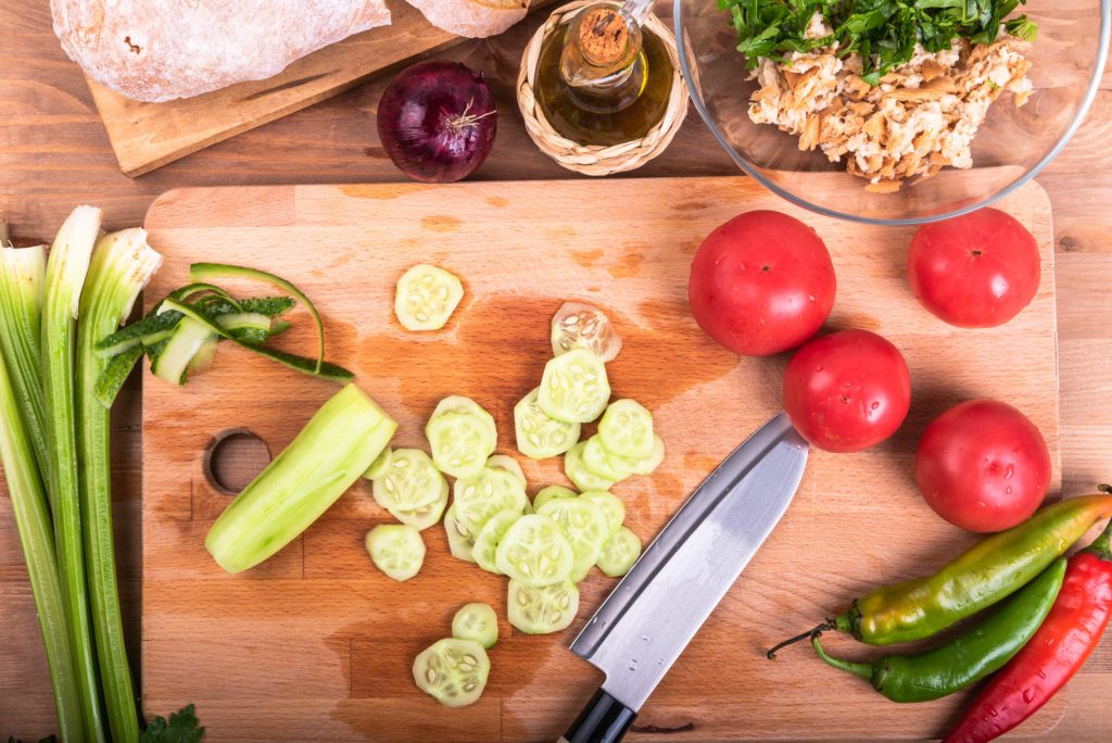 chopping veggies yourself will help you to eat well on a budget